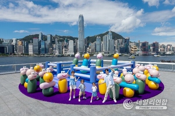 Happy Flipping Boxing Ring with more than 30 inflatables tumblers is set against the stunning backdrop of Victoria Harbour